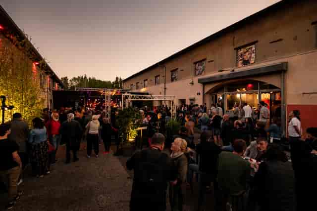 Energetic outdoor event at Grande Salle, Les Abattoirs SMAC, perfect for festivals and networking.