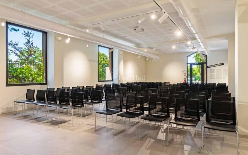 Tony Garnier event space with black chairs and natural light for meetings or presentations