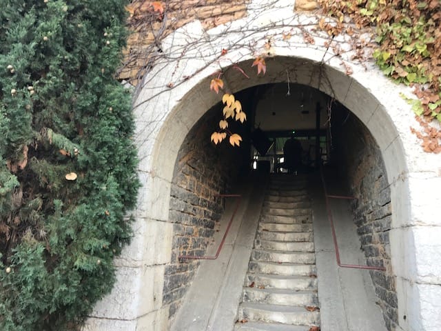 Underground archway entrance at Fort de Vaise, ideal for unique events and outdoor layouts.