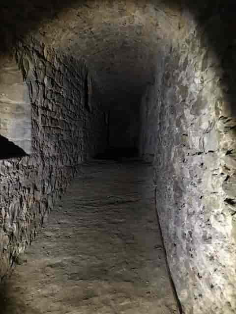 Stone corridor in Fort de Vaise, ideal for immersive events or ghost tours.