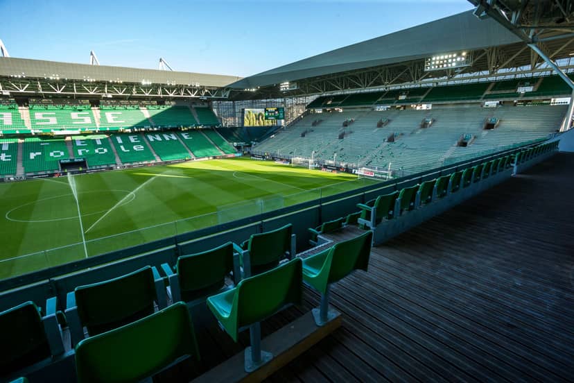 Vibrant stadium with green pitch, perfect for sports events and large gatherings.