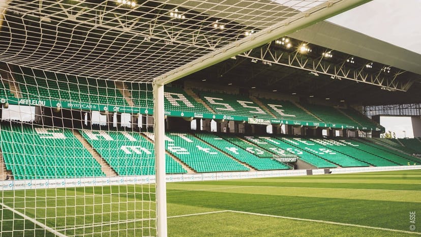 Vibrant soccer stadium with green pitch, ideal for corporate events and gatherings.