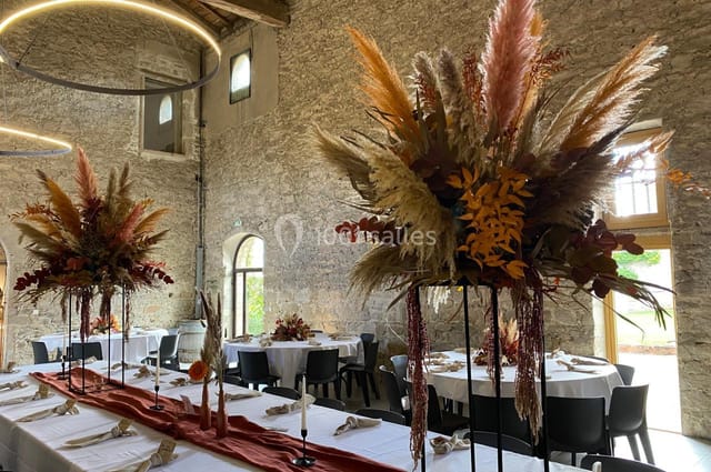 Elegant conference room at Château La Gallée with floral centerpieces, ideal for weddings and events.