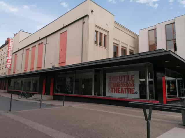 Modern theater exterior with large windows, perfect for events and meetings.