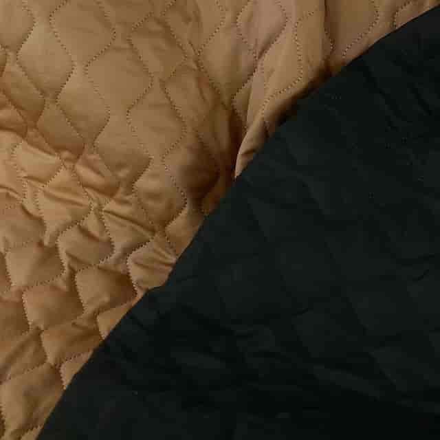 Textured tan and black fabrics at Atelier de la Création for event décor ideas.
