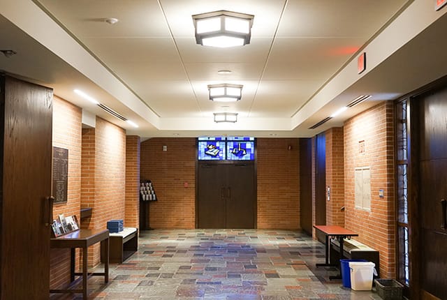 Spacious hallway with stained glass at First Presbyterian Church, ideal for events and networking.