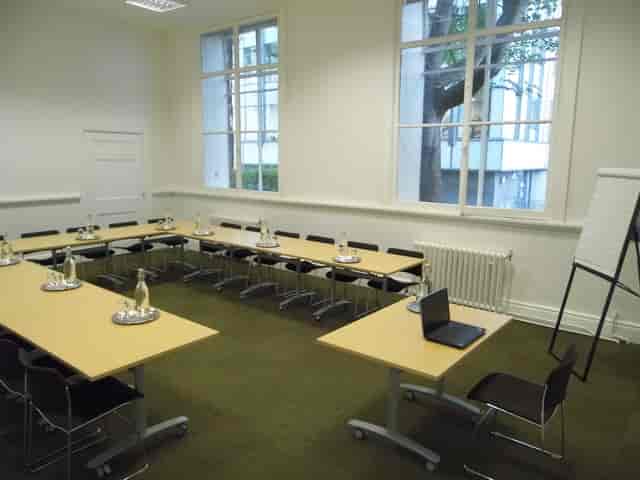 G1 Meeting Room at Friends' Meeting House, U-shaped tables for collaboration and events.