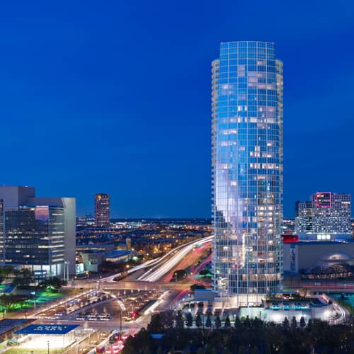 Modern Museum Tower skyscraper at dusk, ideal for events and conferences.