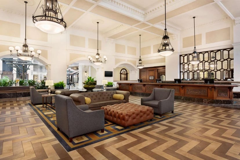 Spacious Embassy Suites meeting room with elegant design, ideal for networking events.
