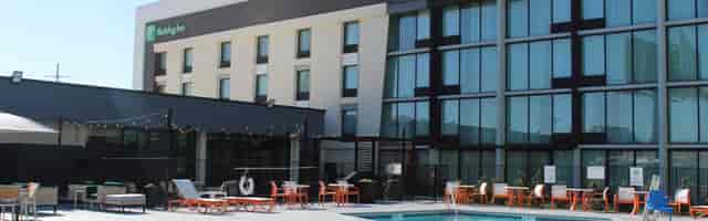Modern hotel business center with pool, ideal for networking events and conferences.