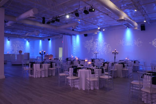 Elegant banquet hall with round tables, perfect for corporate and social events.