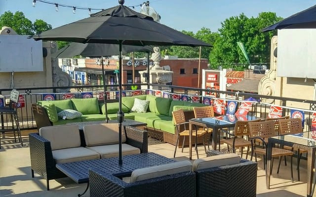 Vibrant rooftop event space at Dodie's Reef with stylish seating, perfect for celebrations.