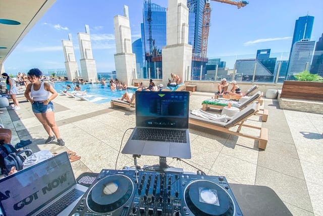 Sky Lounge rooftop pool with skyline view, perfect for summer cocktail parties and events.