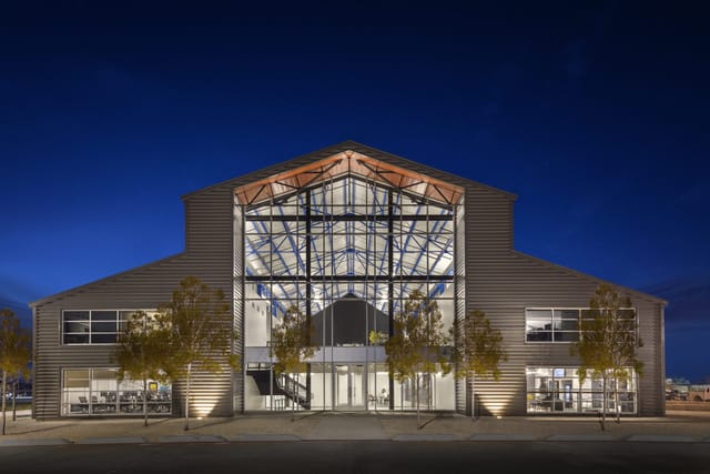 Atrium in The Cannon, modern venue with glass panels for events and gatherings.