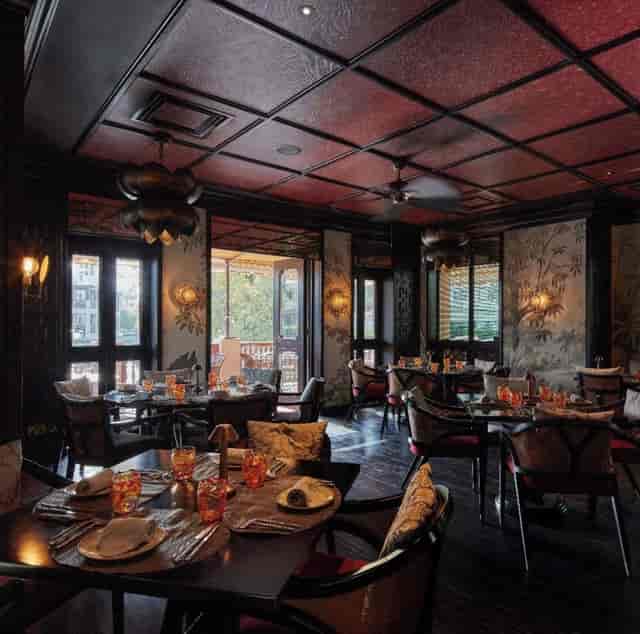 Elegant dining room at Pai Thai, Jumeirah Al Qasr, perfect for upscale events and gatherings.