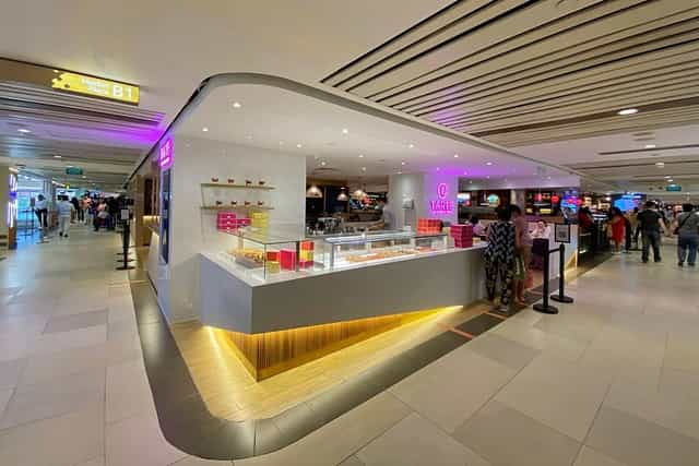 Vibrant retail shop in Tarte by Cheryl Koh, perfect for networking events and casual meetings.