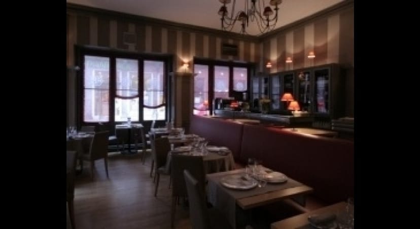 Stylish restaurant interior with warm lighting, ideal for intimate dining and corporate events.