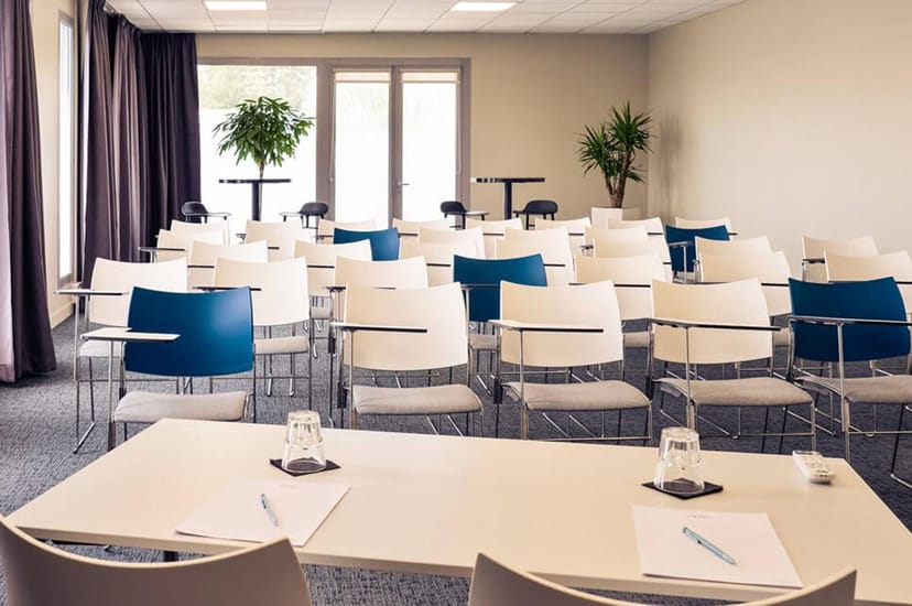 Meeting Room 3 at Hotel Ambassadeur, featuring modern chairs for professional events.