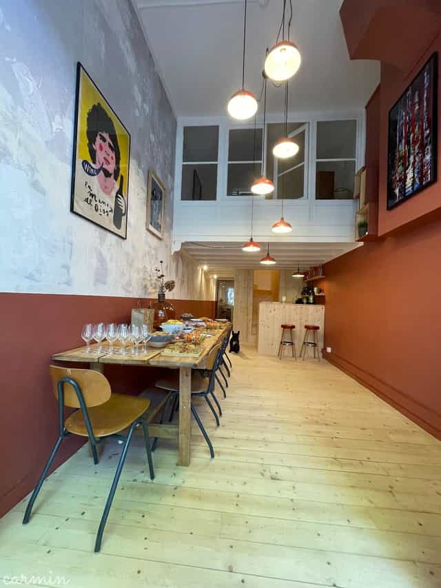 Main Room at Bellecave La Table with long wooden table, perfect for private events and workshops.