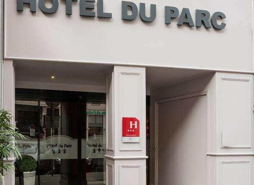 Boutique hotel entrance, modern façade, ideal venue for gatherings and events.