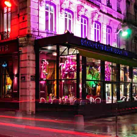 Vibrant café with colorful lighting, perfect for events and meetings in Grand Café des Négociants.
