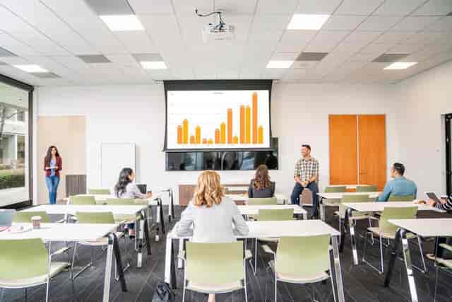 Modern meeting room in Silicon Valley Center set for a presentation on analytics.