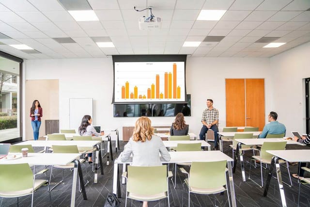 Modern meeting room in Silicon Valley Center set for a presentation on analytics.