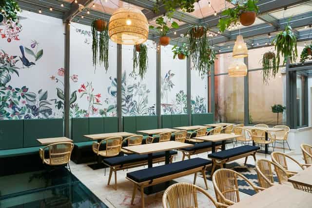 Vibrant floral mural event space for casual gatherings and workshops at Food Traboule.