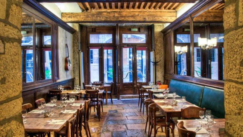 Charming restaurant interior with warm wood tones, perfect for intimate gatherings and events.