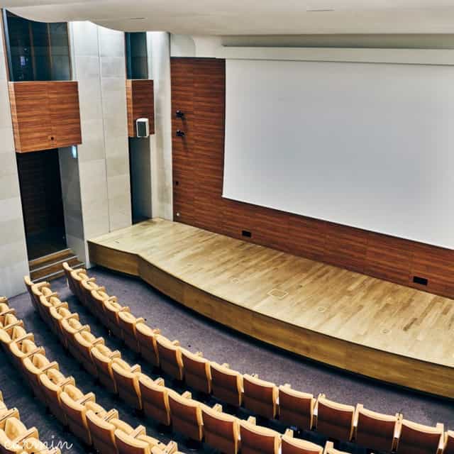Spacious Salon Marceau auditorium with tiered seating for conferences and seminars.