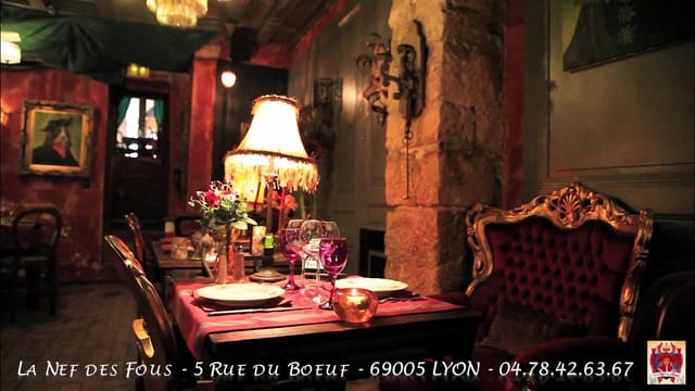 Elegant dining table in cozy La Nef des Fous for upscale events and gatherings.