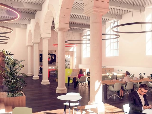 Modern conference center in Grand Hôtel-Dieu with high ceilings, ideal for events.