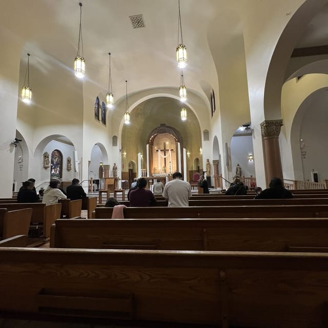 Serene church courtyard with wooden pews, perfect for spiritual gatherings and ceremonies.