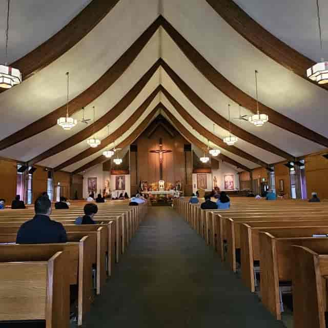 Fellowship Hall interior, wooden pews, ideal for spiritual gatherings and community events.