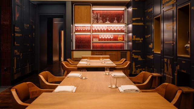 Elegant dining space with warm wood tones, perfect for private meetings and VIP dinners.