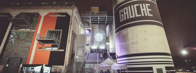 Salle de concert at Le Sucre, featuring industrial silos for contemporary event experiences.