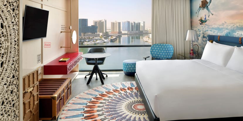 Flamingo in Hotel Indigo Dubai: modern room with skyline view for corporate events.