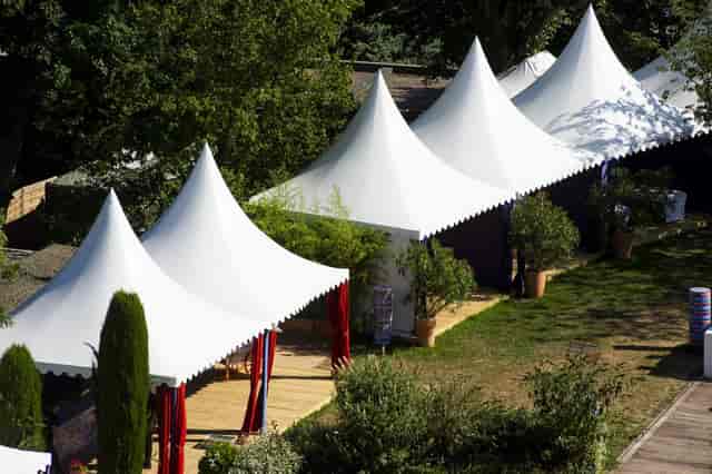 Elegant event tents in lush Nuits de Fourvière, ideal for weddings and gatherings.