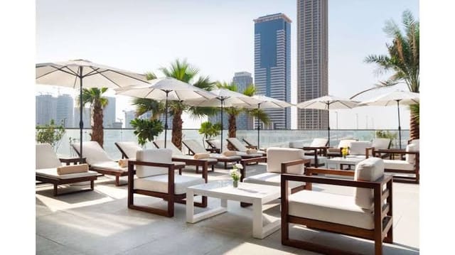 Rooftop lounge at Manzil, stylish seating for networking events in Park Regis Business Bay.
