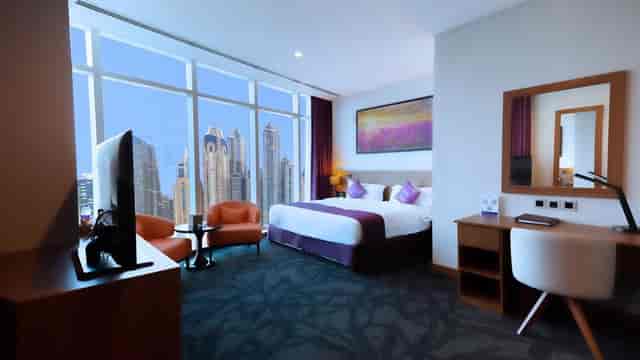 Modern hotel room at Park Regis Business Bay with city views for corporate retreats.