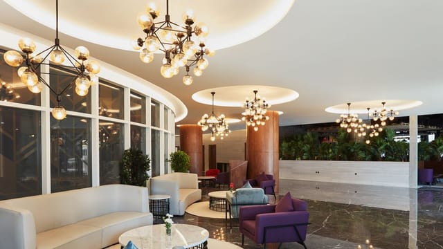 Sophisticated lobby at Park Regis Business Bay, ideal for meetings and networking events.