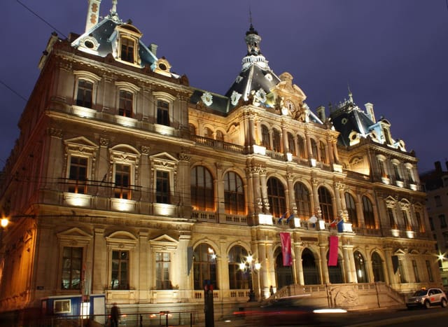Elegant Hôtel de Ville in Lyon, beautifully lit for upscale events and meetings.