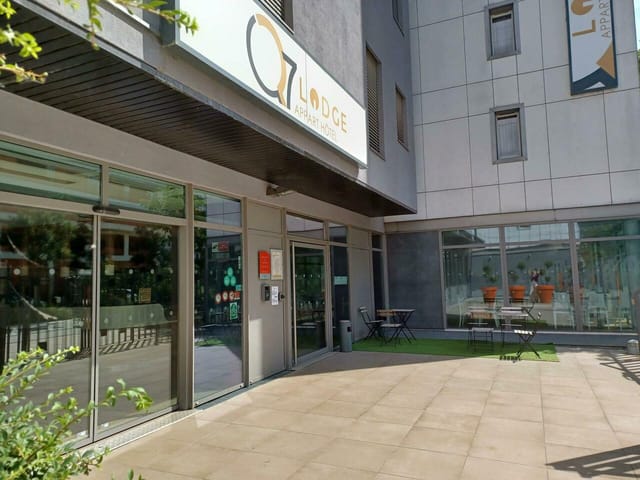 Modern reception area at Q7 Lodge with large windows, great for meetings and events.