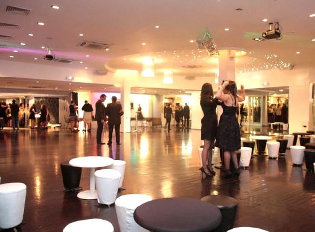 Versatile event space with modern design, ideal for corporate meetings and social gatherings.