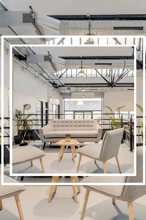 Modern lounge in L'Atelier with comfortable seating for networking events.