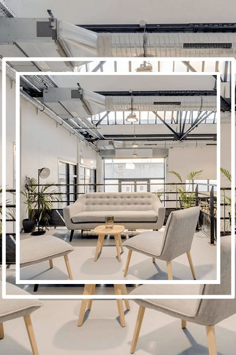 Modern lounge in L'Atelier with comfortable seating for networking events.