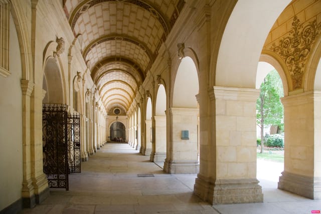 Elegant corridor with arches at Lyon Fine Arts Museum, ideal for sophisticated events.