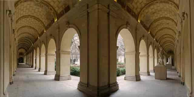 Elegant arched colonnade in Lyon Fine Arts Museum gardens, ideal for events and receptions.
