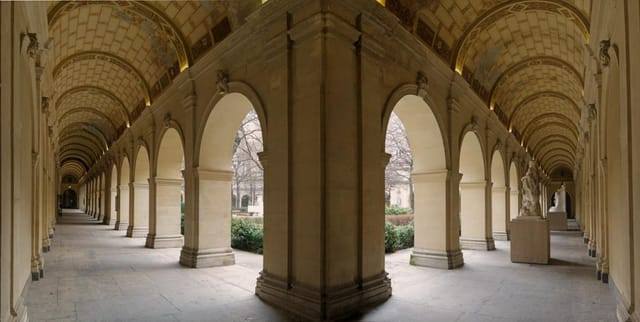 Elegant arched colonnade in Lyon Fine Arts Museum gardens, ideal for events and receptions.