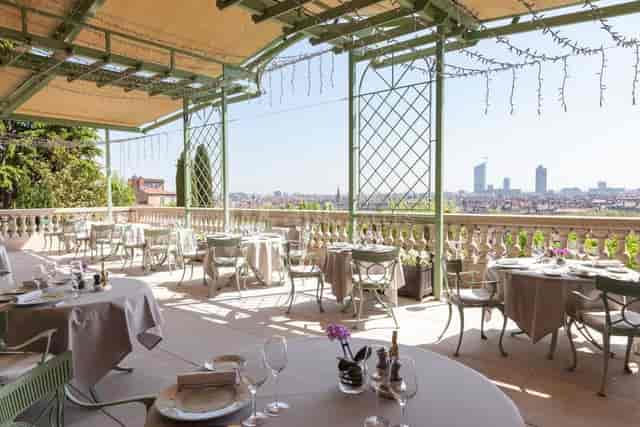 Elegant outdoor dining terrace at Villa Florentine, perfect for upscale events and meetings.